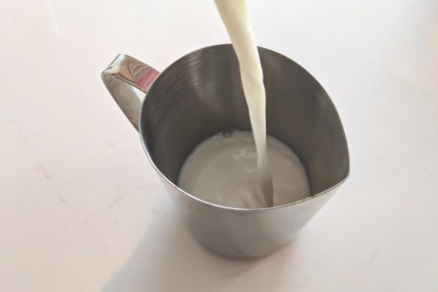 Pour Milk into Pitcher